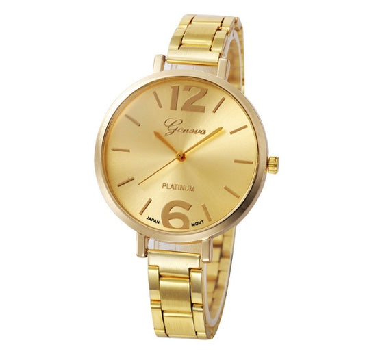 Gold wristwatch with a white background