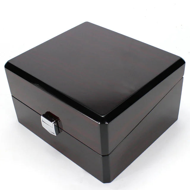 Black jewelry box with a silver clasp on a white background