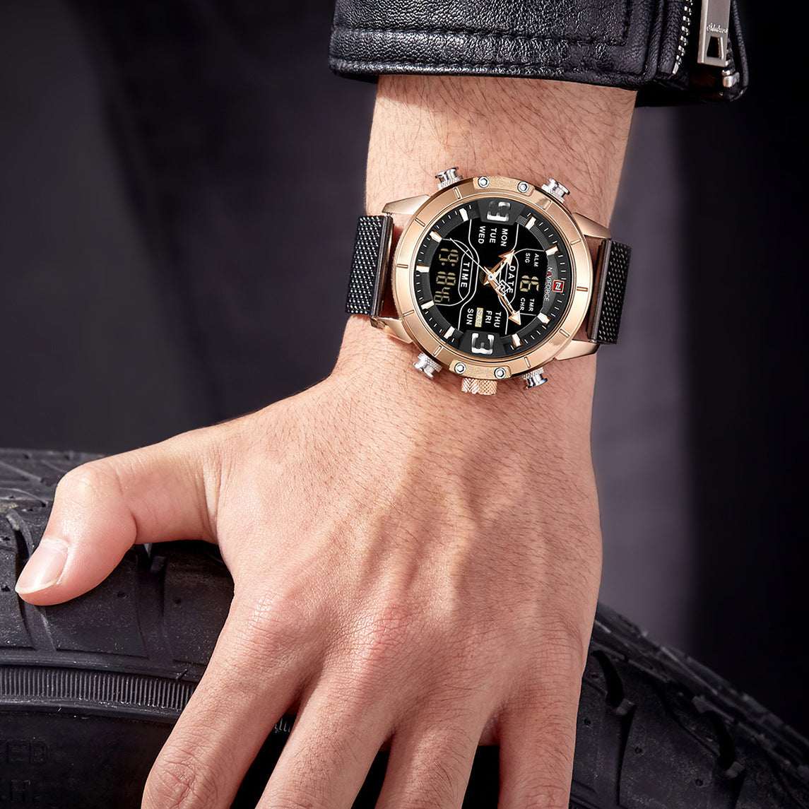 Hand wearing a gold wristwatch with a black face on a dark background