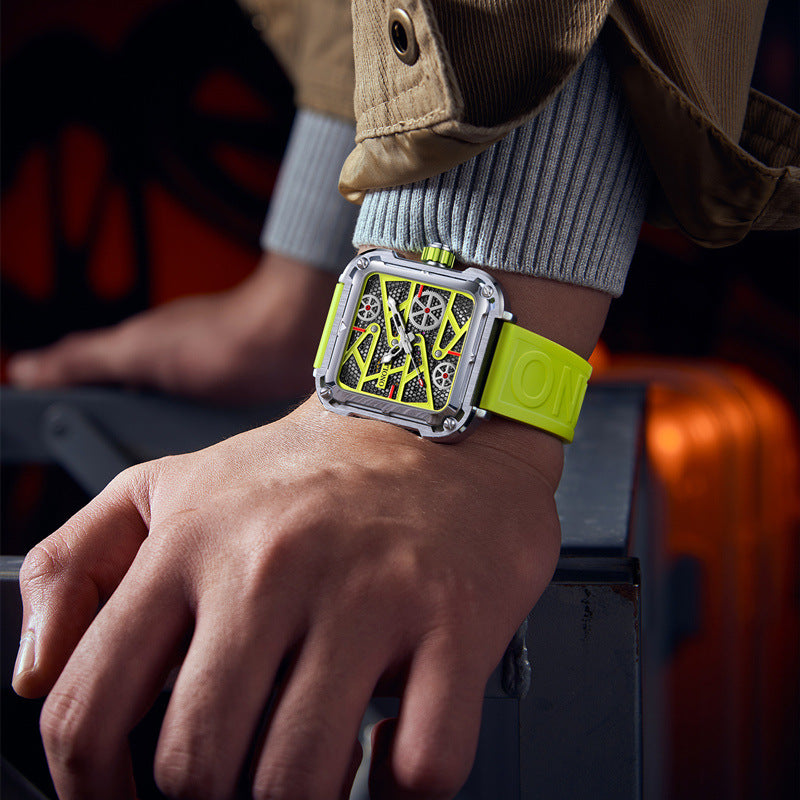 Close-up of a wrist wearing a watch with a bright green strap against a blurred background