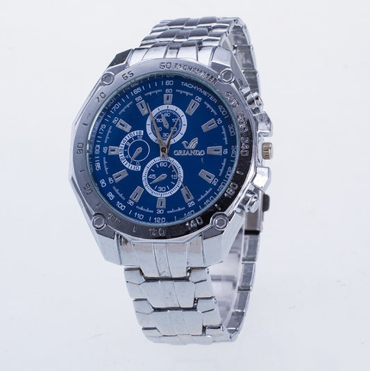 Silver watch with a blue face on a light gray background