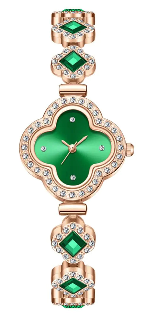 Green watch with rose gold case and emerald green gemstones on a white background