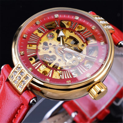 Red and gold mechanical watch with a red leather strap