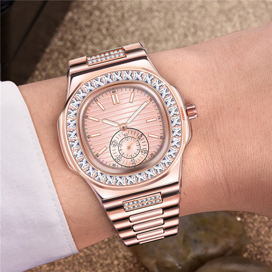 Rose gold watch with diamond accents on a wrist