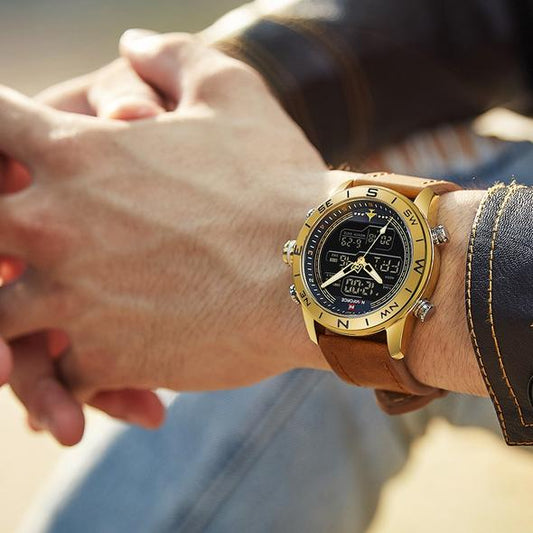 Gold wristwatch on a person's wrist with a blurred background